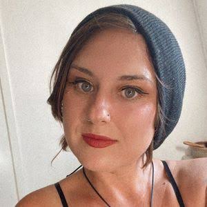 Kirby Khalon Amour wearing a dark knit hat